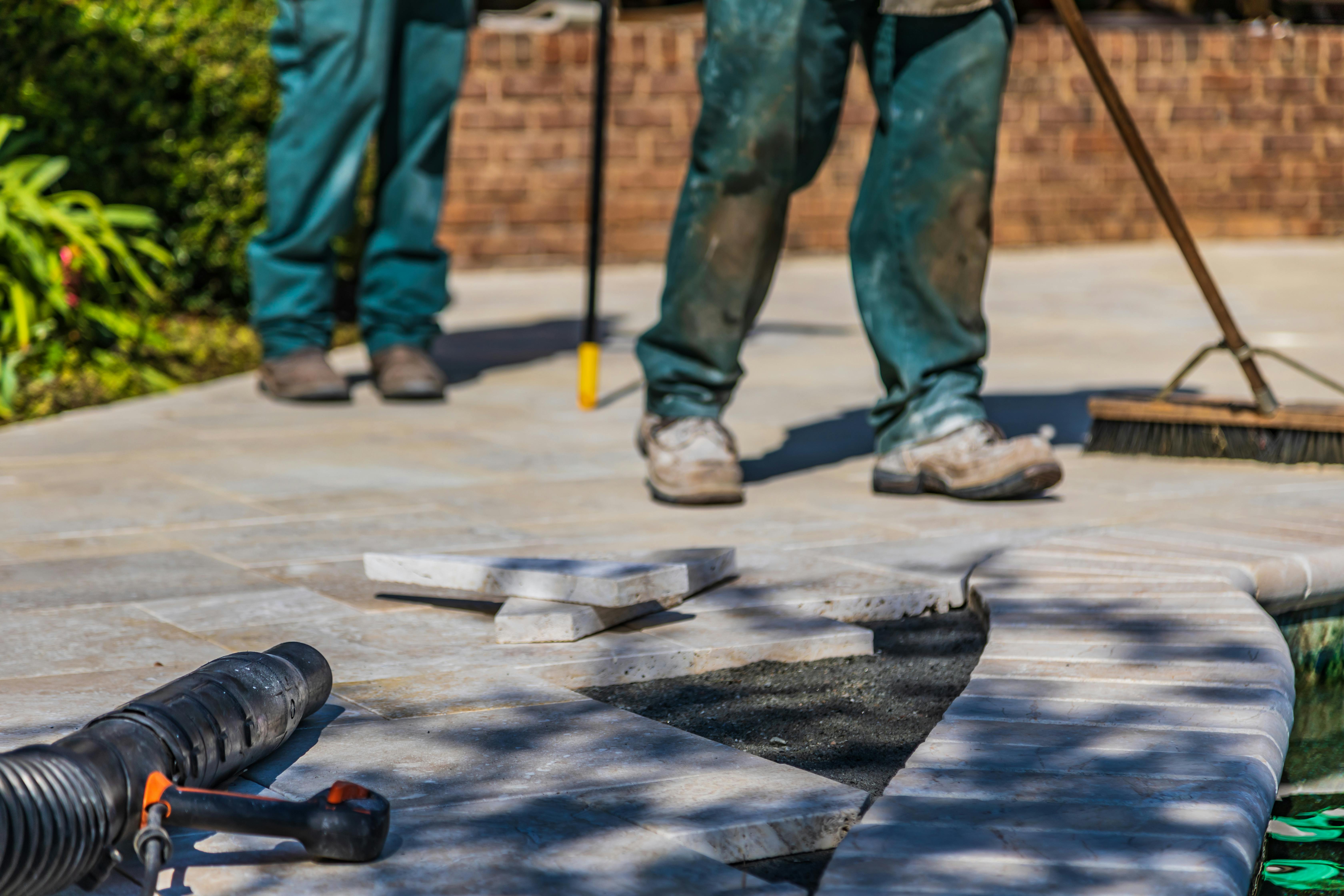 Tiler laying floor tiles